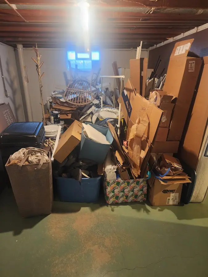 Roll-off dumpster container at job site for 2 Yard Dumpster Rental in Nampa